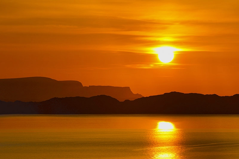 Sunset over Skye and Rona